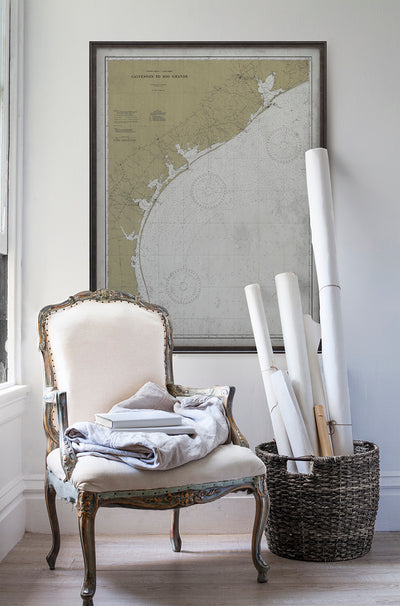 Vintage historic nautical chart of Galveston to Rio Grande in room with white walls with vintage furniture and vintage decor.