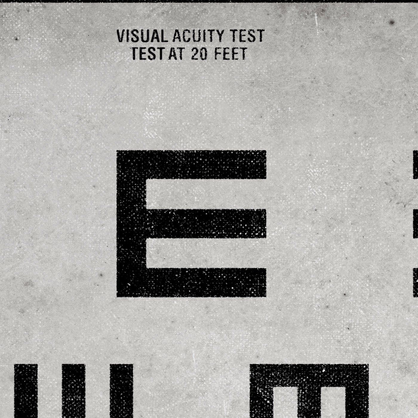 a large number of black and white geometric shapes, including a large "E" and smaller "E" shapes. The text "VISUAL ACuity Test" is visible above the shapes, indicating that this is a visual acuity test. The test is being conducted at 20 feet, as indicated by the text above the test area.