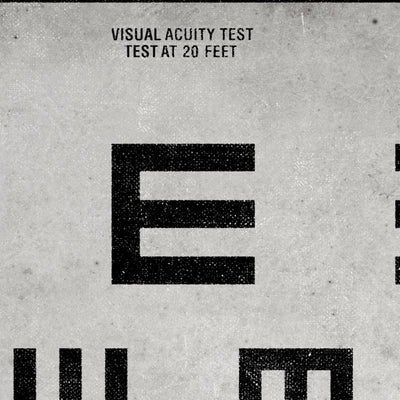 a large number of black and white geometric shapes, including a large "E" and smaller "E" shapes. The text "VISUAL ACuity Test" is visible above the shapes, indicating that this is a visual acuity test. The test is being conducted at 20 feet, as indicated by the text above the test area.