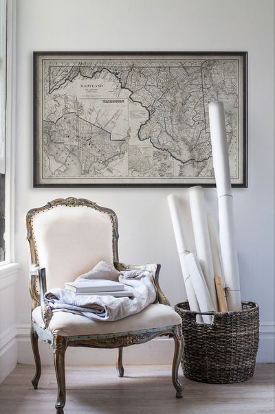 Vintage historic road map of Maryland in room with white walls with vintage furniture and vintage decor.
