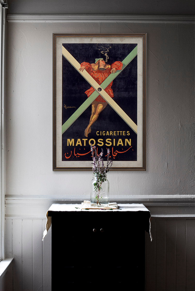 Cigarettes Matossian vintage wall art poster on white wall with vintage furniture and vintage decor.