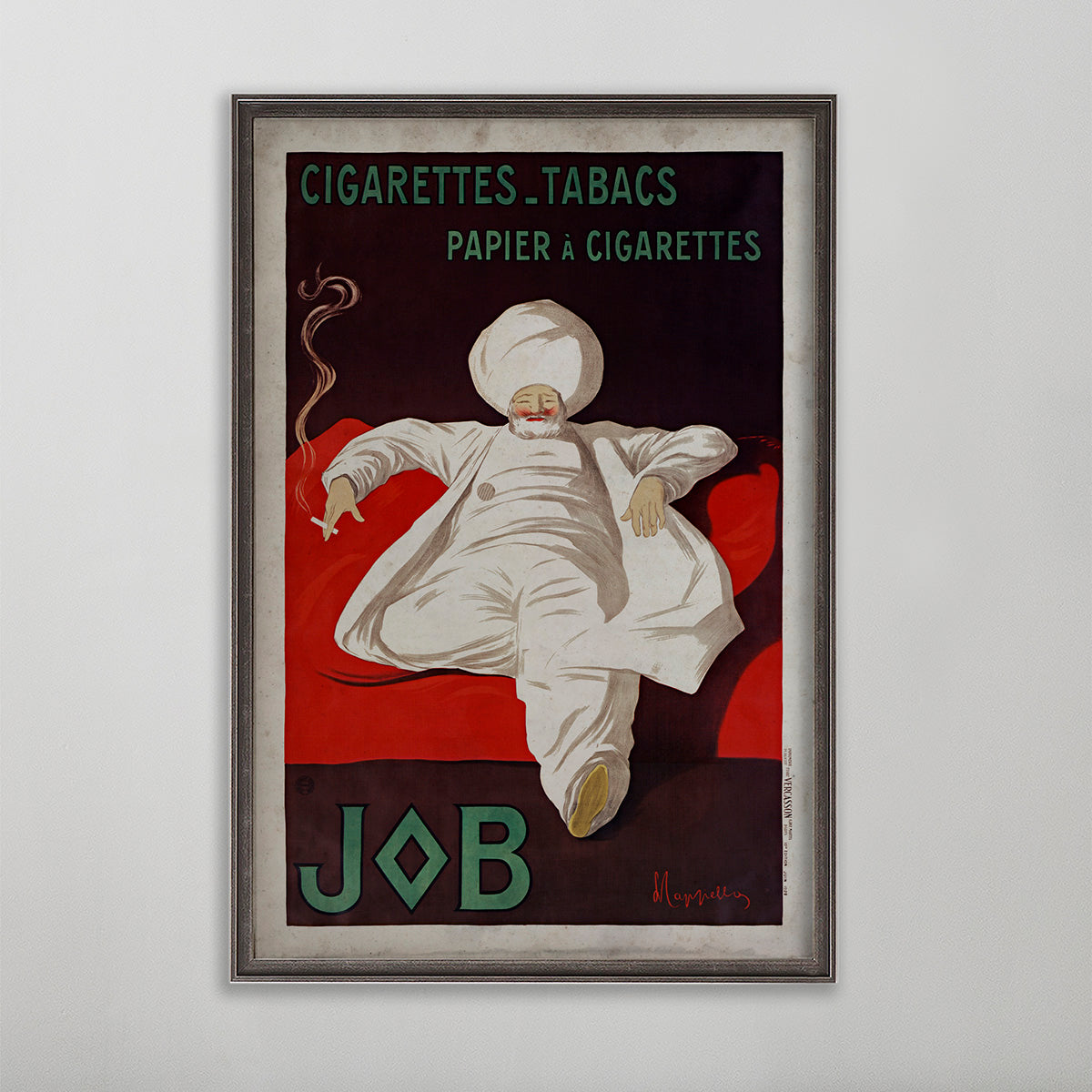 Job Cigarettes vintage poster wall art by leonetto cappiello. Man sitting on red couch with a turban smoking a cigarette. 