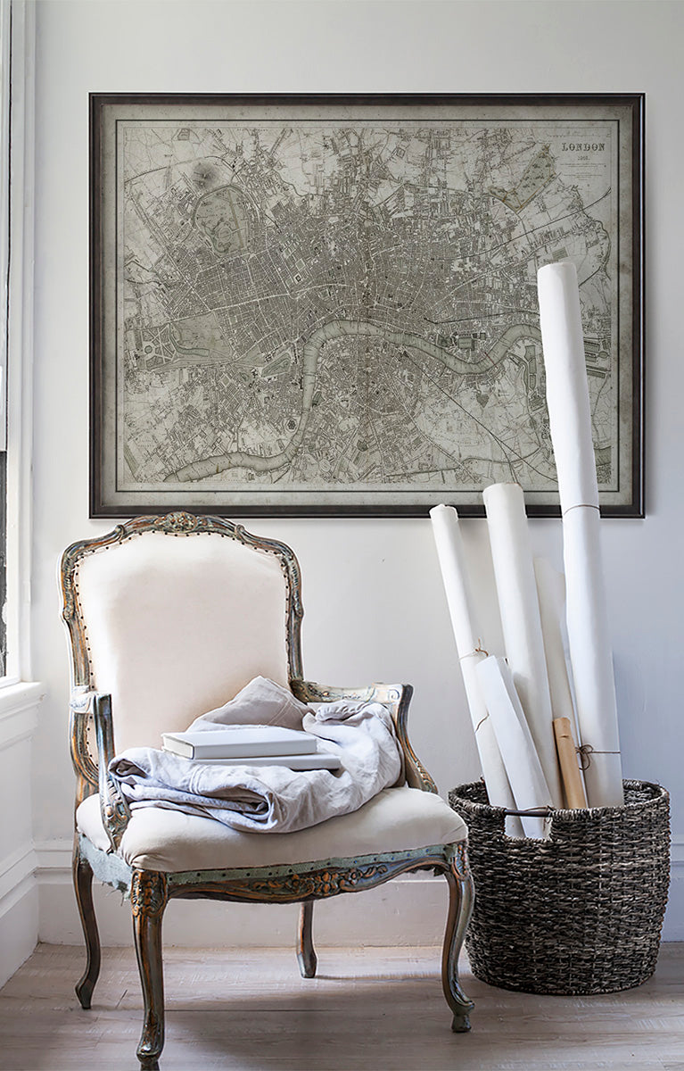 Vintage historic London, England map in room with white walls with vintage furniture and vintage decor.