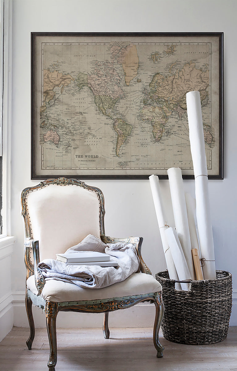 Vintage historic map of the World in room with white walls with vintage furniture and vintage decor.