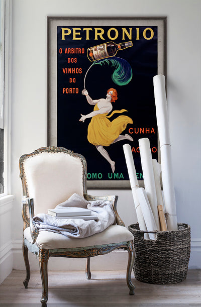 Leve Como Uma Penna vintage poster wall art on white wall with vintage furniture and vintage decor.