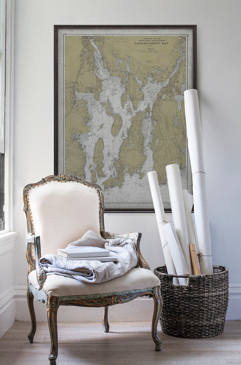 Vintage historic nautical chart of Narragansett Bay, Rhode Island in room with white walls with vintage furniture and vintage decor.