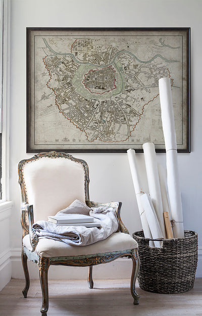 Vintage historic map of Vienna, Austria in room with white walls with vintage furniture and vintage decor.