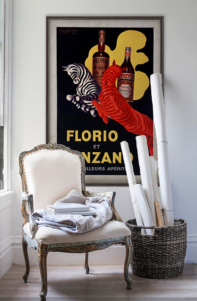 Florio et Cinzano vintage poster wall art on white wall with vintage furniture and vintage decor.