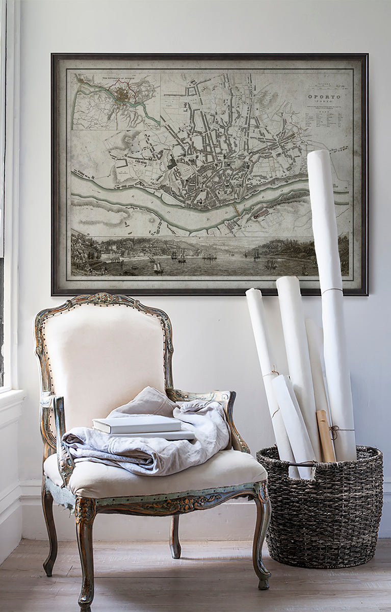 Vintage historic map of Porto, Portugal in room with white walls with vintage furniture and vintage decor.