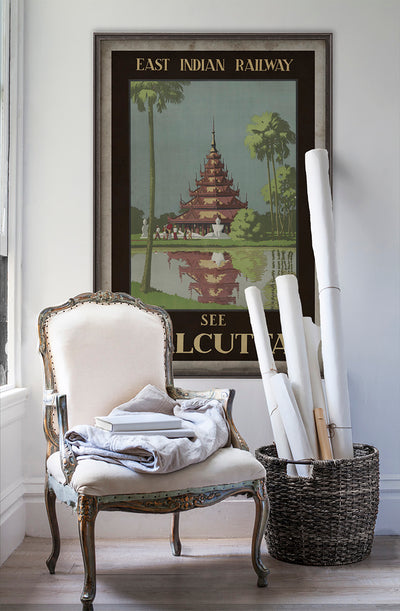 India Calcutta travel poster wall art poster on white wall with vintage furniture and vintage decor.