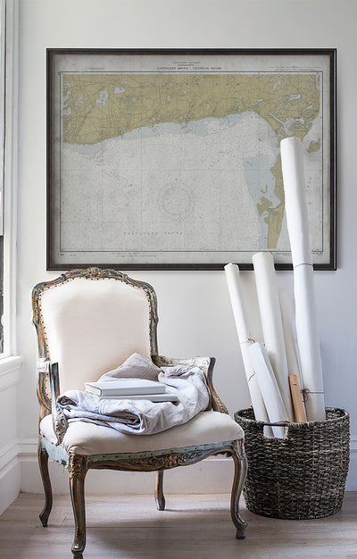 Vintage historic nautical chart of Nantucket Sound and Chatham in room with white walls with vintage furniture and vintage decor.