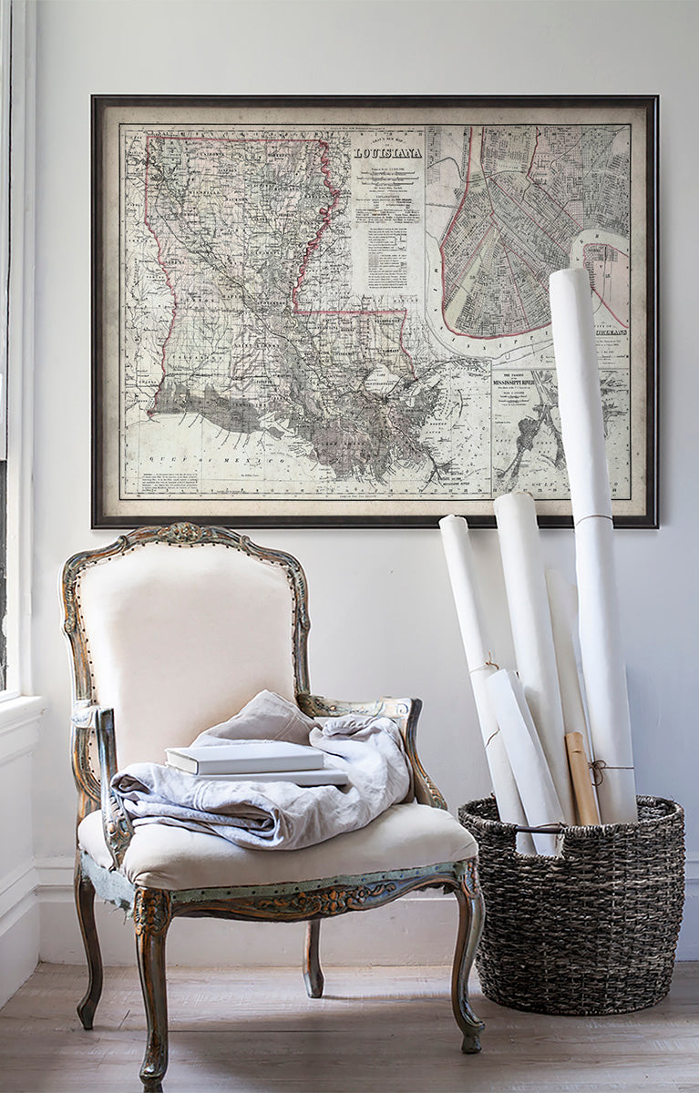 Vintage historic Louisiana map in room with white walls with vintage furniture and vintage decor.