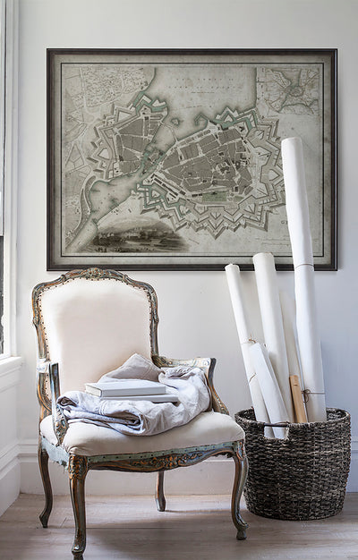 Vintage historic Geneva, Switzerland map in room with white walls with vintage furniture and vintage decor.