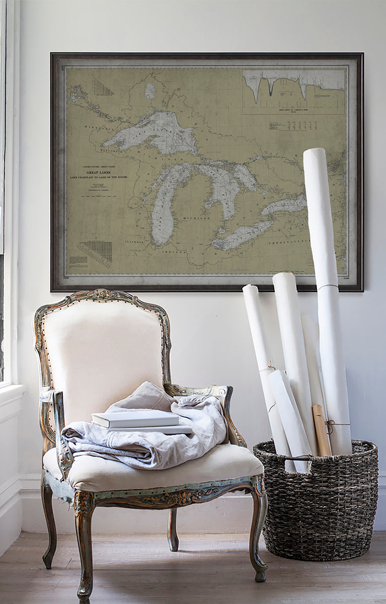 Vintage historic nautical chart of The Great Lakes in room with white walls with vintage furniture and vintage decor.
