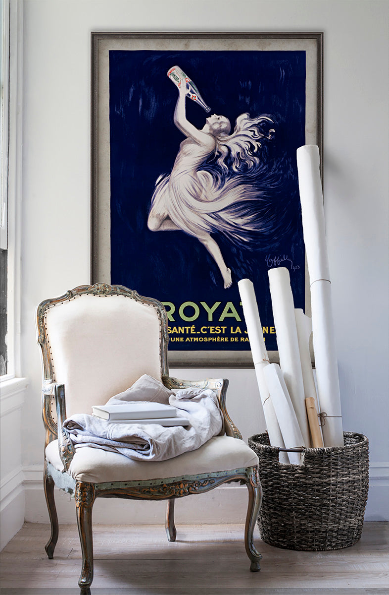 Royat C'est La Sante vintage poster wall art on white wall with vintage furniture and vintage decor.