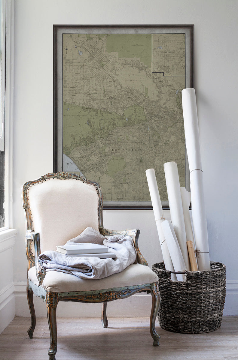 Vintage historic Los Angeles map in room with white walls with vintage furniture and vintage decor.