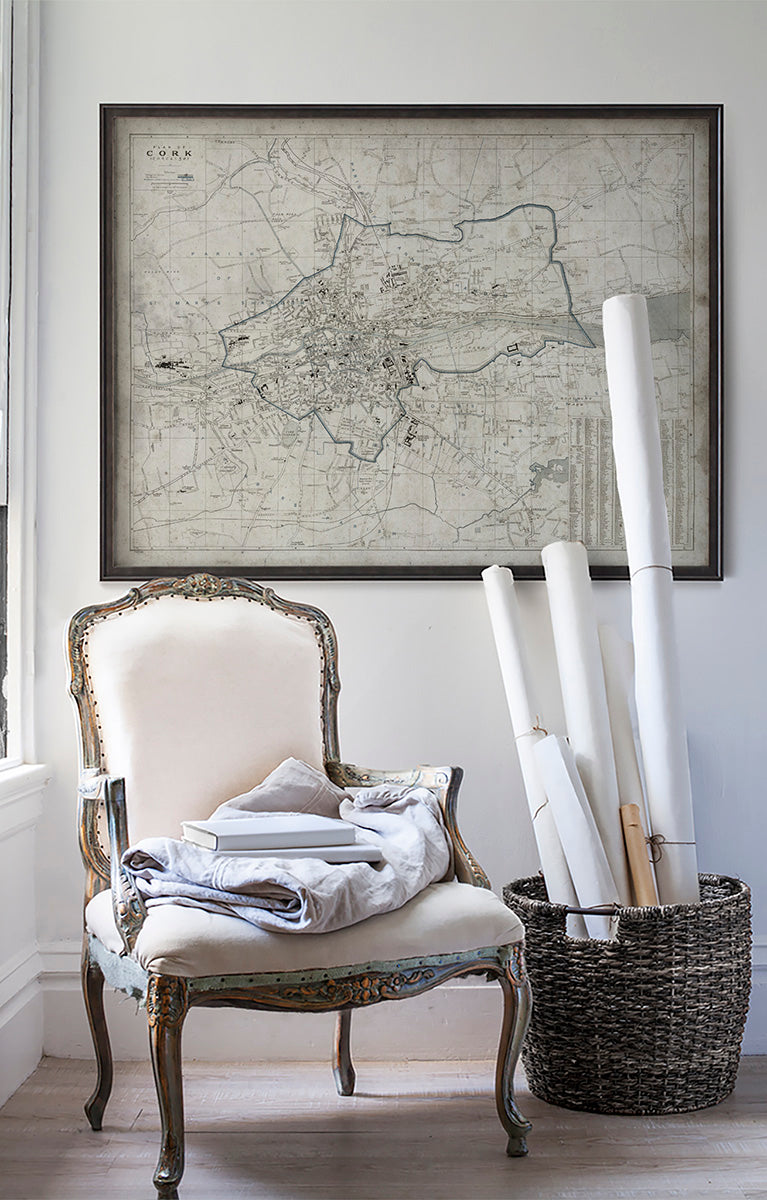 Vintage historic Cork map in room with white walls with vintage furniture and vintage decor.