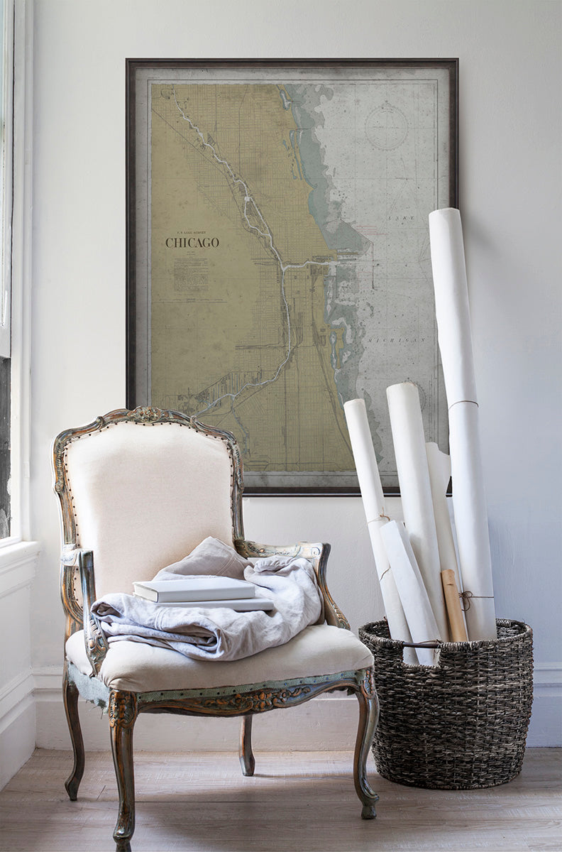 Vintage historic nautical chart of Chicago, Illinois in room with white walls with vintage furniture and vintage decor.