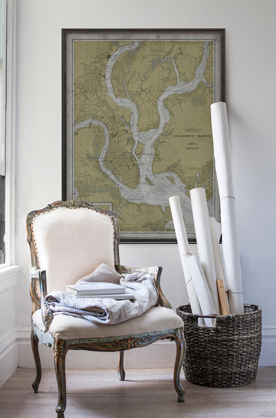 Vintage historic nautical chart of Charleston Inner Harbor in room with white walls with vintage furniture and vintage decor.