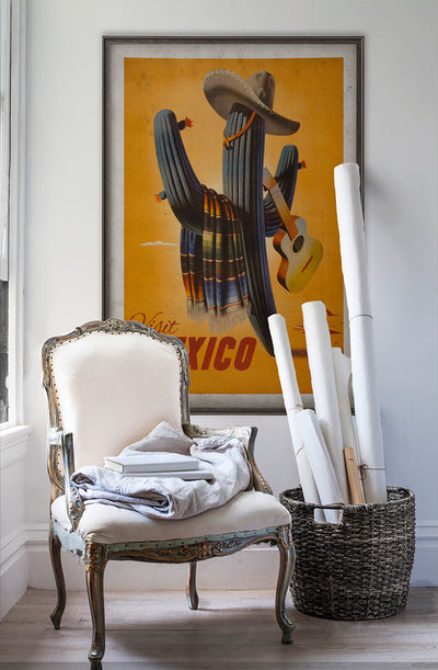 Mexico travel poster wall art poster on white wall with vintage furniture and vintage decor.
