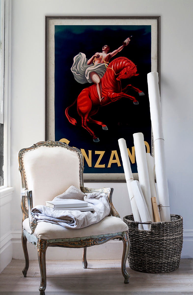 Cinzano Italian vintage wall art poster on white wall with vintage furniture and vintage decor.