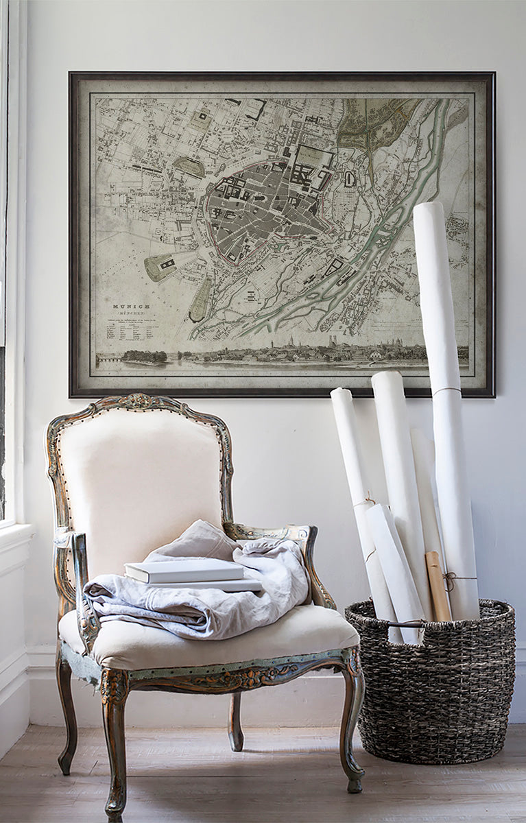 Vintage historic map of Munich in room with white walls with vintage furniture and vintage decor.