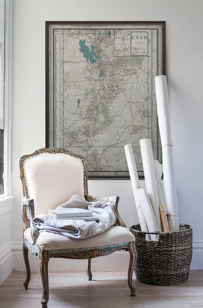 Vintage historic map of Utah in room with white walls with vintage furniture and vintage decor.
