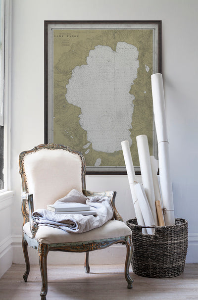 Vintage historic nautical chart of Lake Tahoe in room with white walls with vintage furniture and vintage decor.