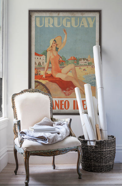 Uruguay travel poster wall art on white wall with vintage furniture and vintage decor.