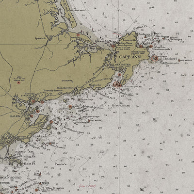 Vintage historic nautical chart of Cape Elizabeth to Cape Cod in room with white walls with vintage furniture and vintage decor.