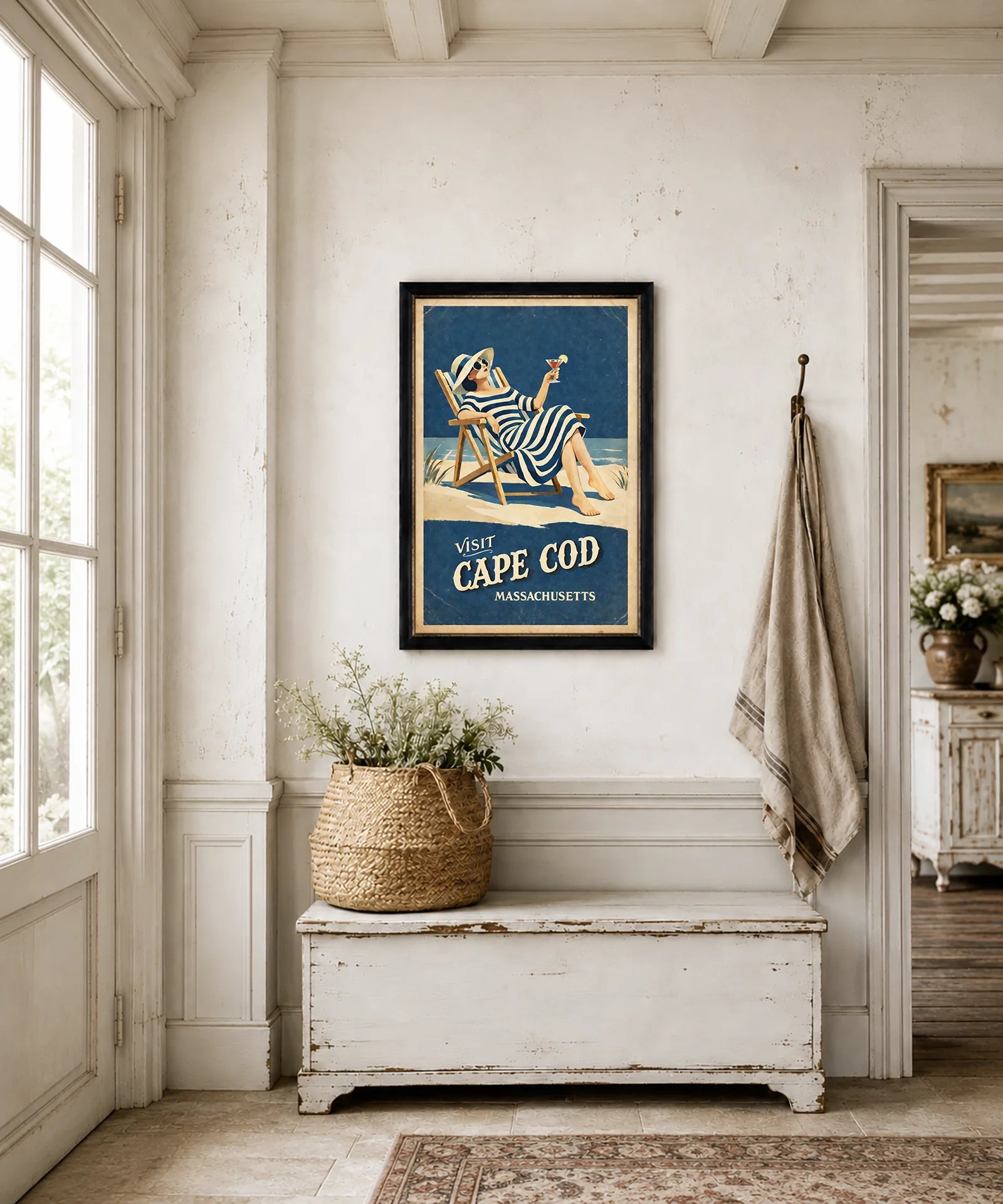 Framed Visit Cape Cod vintage-style print displayed above a console in a living room